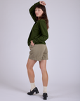 Pleated Trouser Shorts in Khaki Grey angled back view on Alex