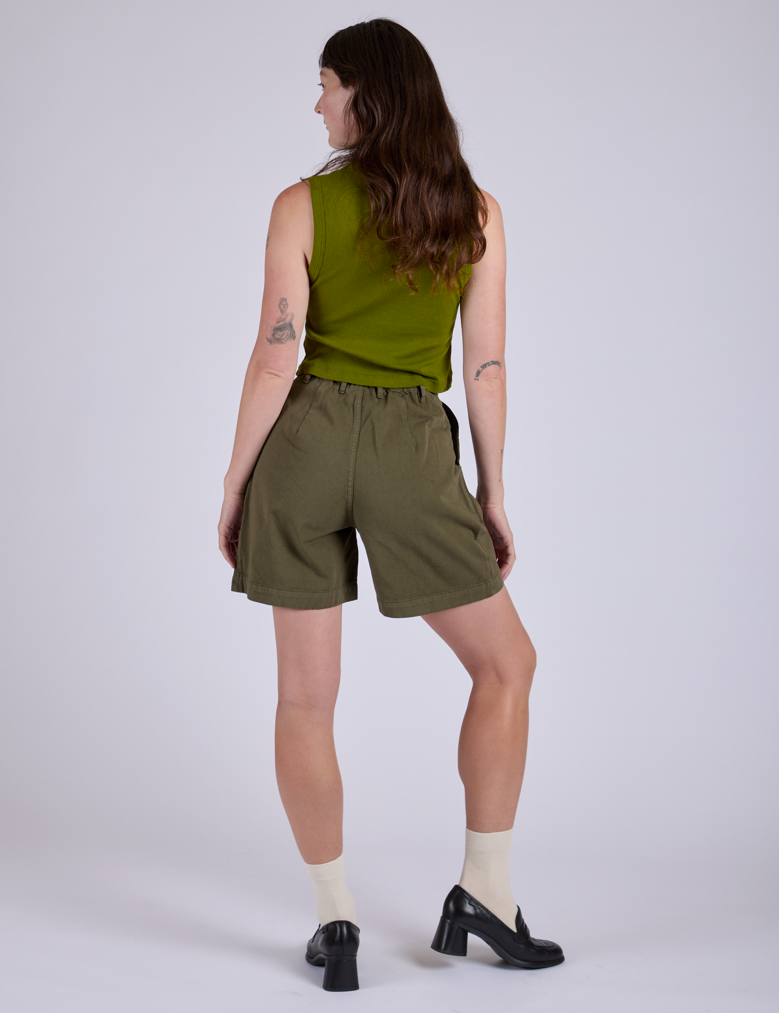 Pleated Trouser Shorts in Surplus Green back view on Alex