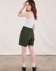 Back view of Trouser Shorts in Swamp Green and Cropped Tank in Vintage Tee Off-White on Hana