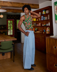 Side view of Kitchen Collection Racerback Tank and light wash Indigo Wide Leg Trousers on Jerrod
