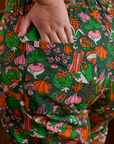 Close up of Juliet's hand in the back pocket of Short Sleeve Jumpsuit in Kitchen Collection