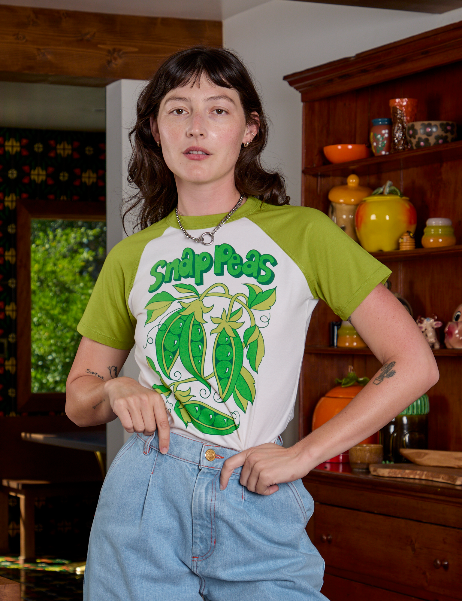 Alex is wearing Short Sleeve Raglan Tee in Snap Peas