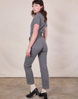 Angled back view of Short Sleeve Jumpsuit in Washed Grey on Alex