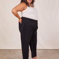 Side view of Western Pants in Basic Black and vintage off-white Tank Top worn by Alicia