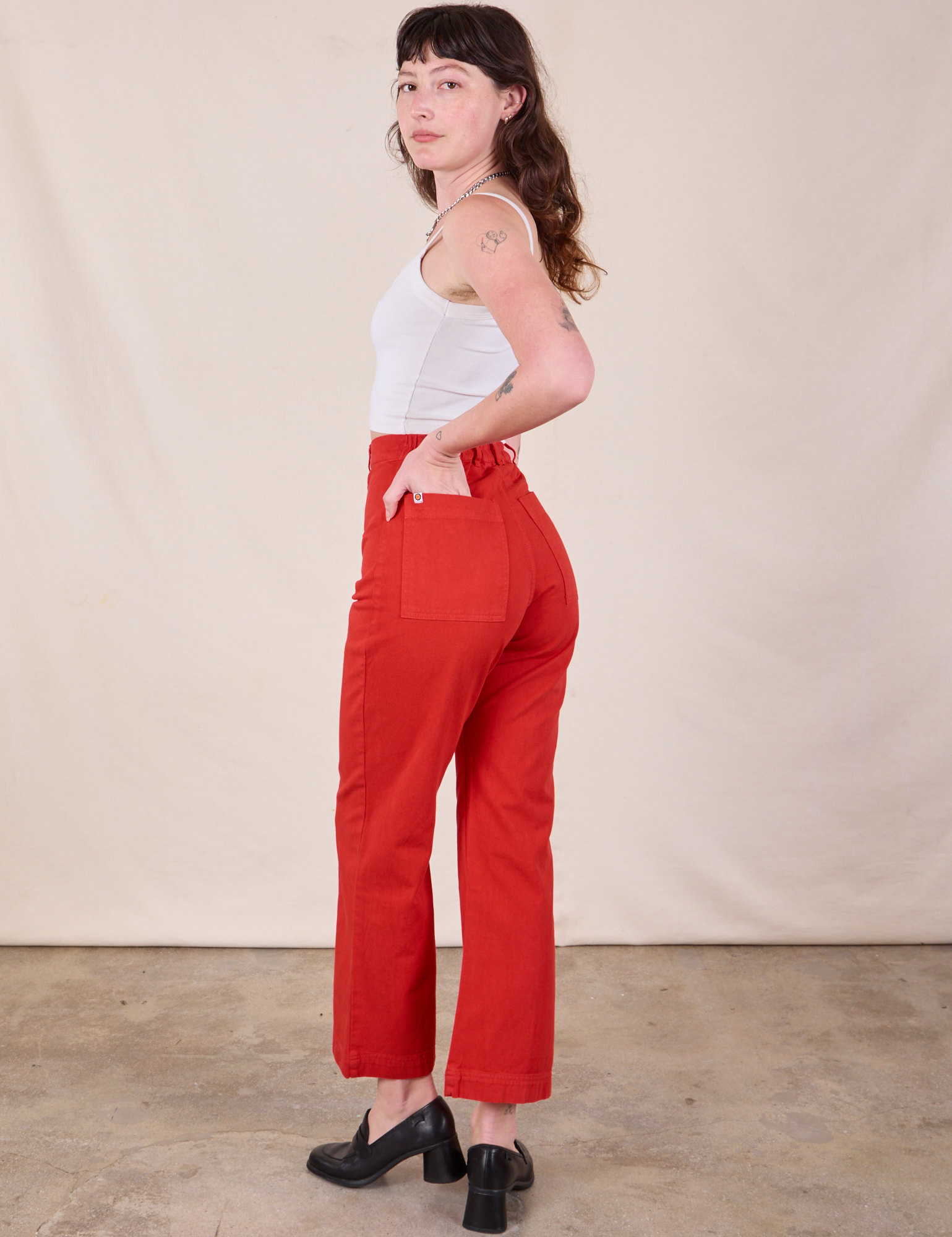 Angled back view of Western Pants in Mustang Red on Alex