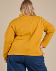 Denim Work Jacket in Mustard Yellow back view on Juliet