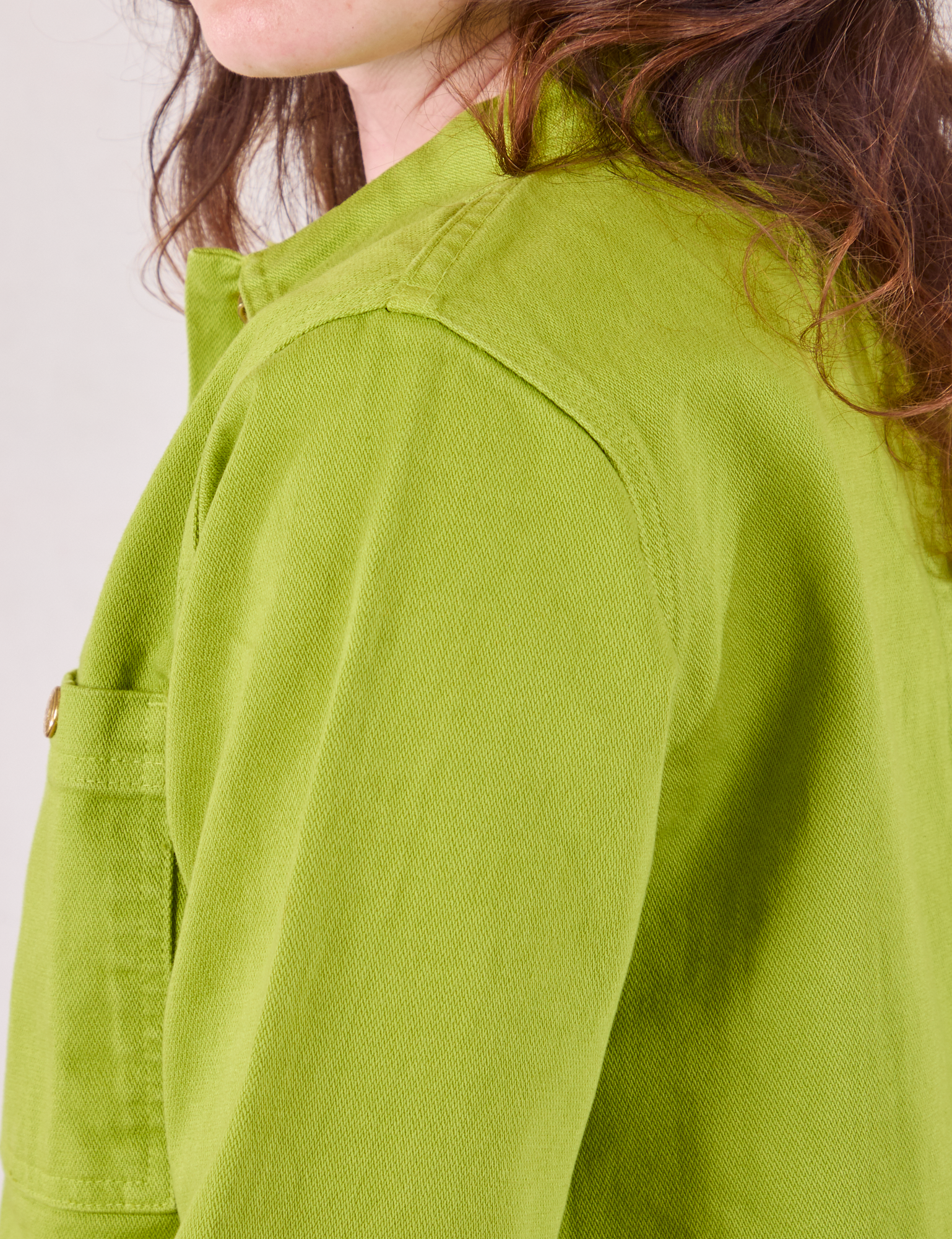 Denim Work Jacket in Gross Green shoulder close up on Alex