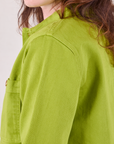 Denim Work Jacket in Gross Green shoulder close up on Alex