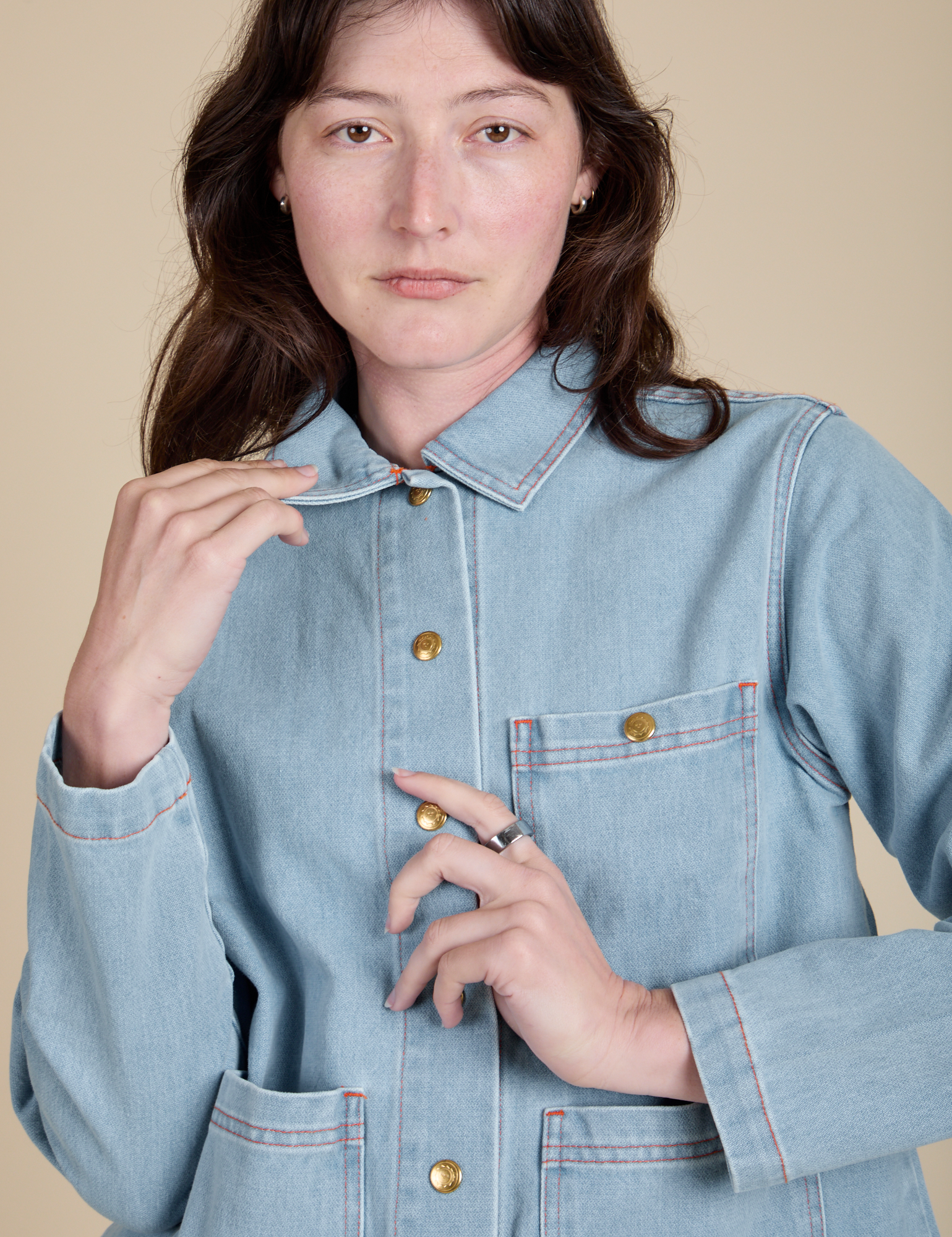 Front close up of Indigo Denim Work Jacket in Light Wash on Alex