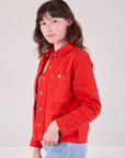 Denim Work Jacket in Mustang Red side view on Alex