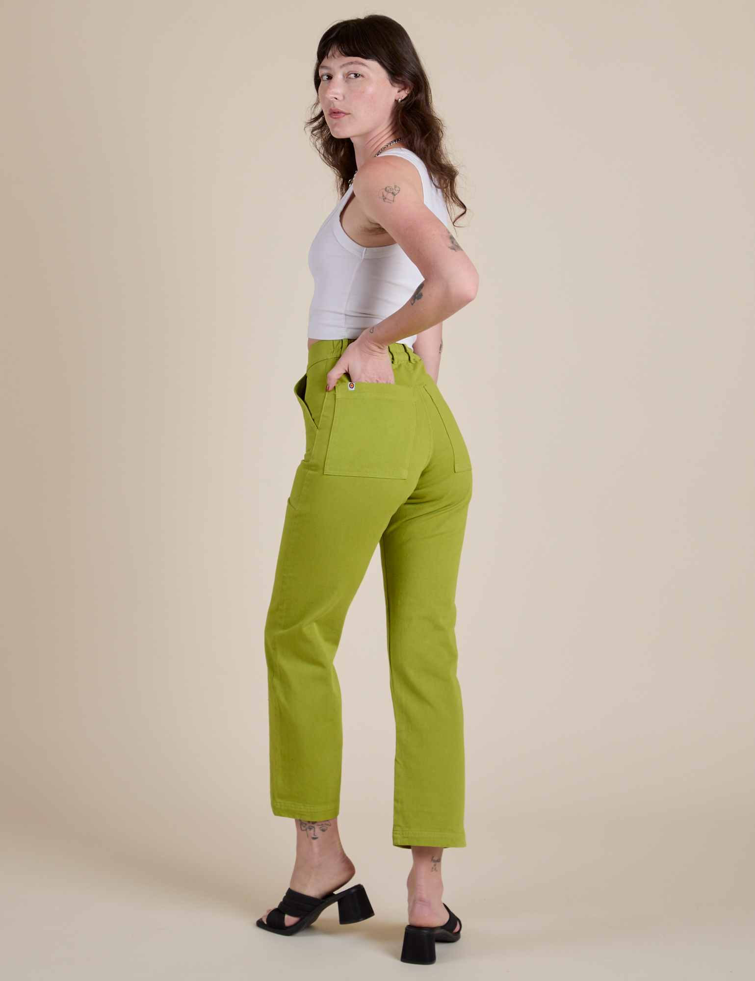 Angled back view of Work Pants in Gross Green on Alex
