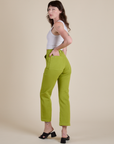 Angled back view of Work Pants in Gross Green on Alex