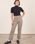Soraya is 5'2" and wearing Petite XXS Work Pants in Khaki Grey paired with 1/2 Sleeve Turtleneck in black