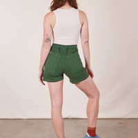 Back view of Classic Work Shorts in Dark Emerald Green and vintage off-white Tank Top worn by Alex