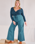 Lish is wearing Wrap Top in Lagoon and marine blue Bell Bottoms