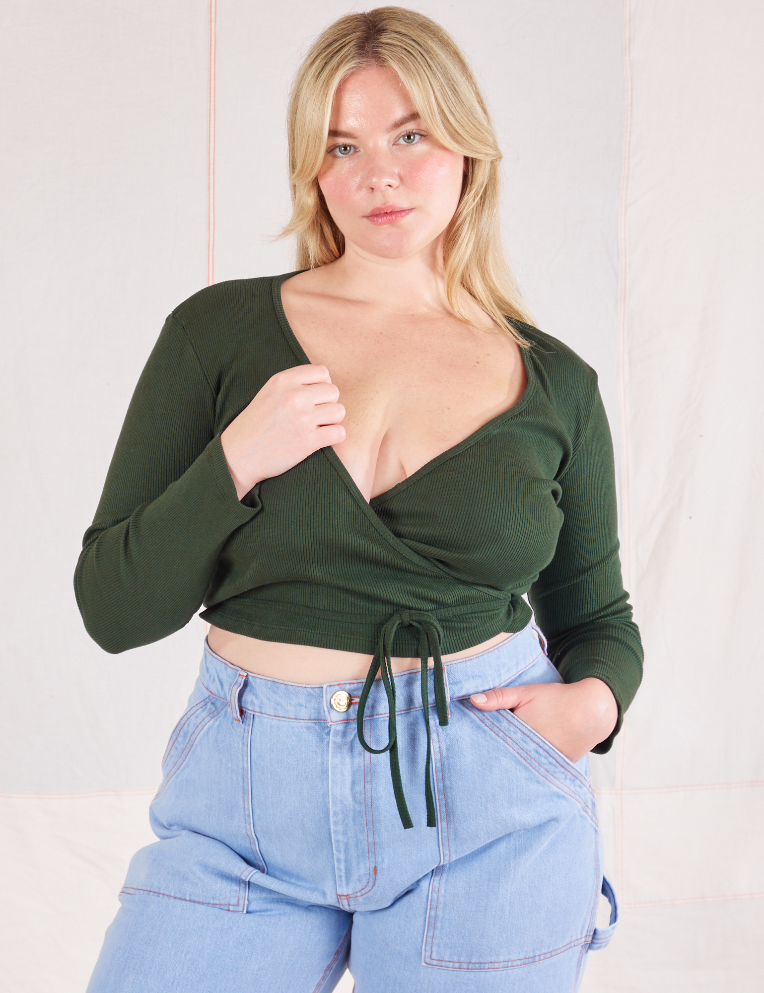 Lish is 5&#39;8&quot; and wearing size 3 Wrap Top in Swamp Green