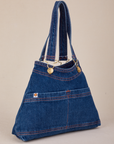 Angled view of dark wash Indigo Overall Handbags