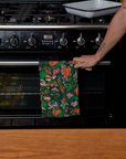 Linen Kitchen Dish Towel hanging on bar in front of oven