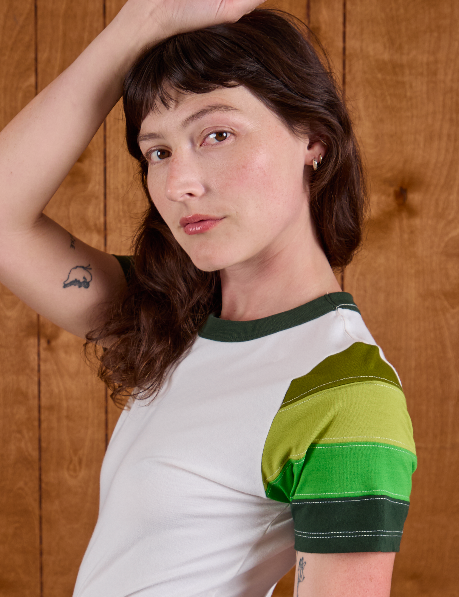 Calypso Tee in Forest side close up on Alex