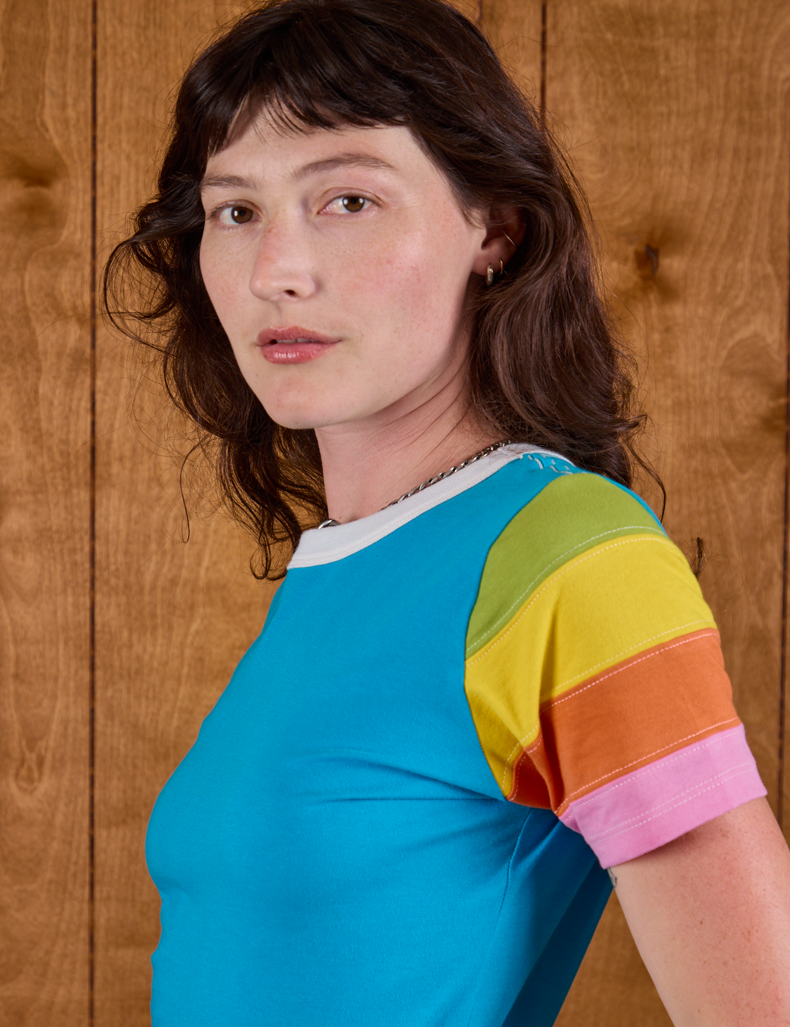Calypso Tee in Rainbow side view close up on Alex