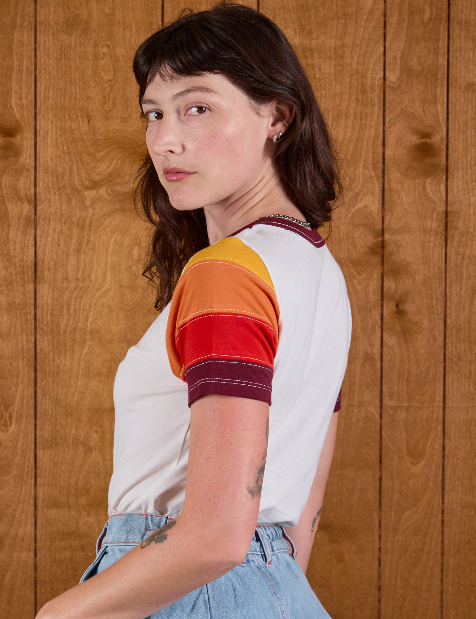 Angled back view Calypso Tee in Desert on Alex