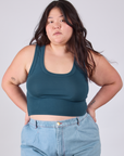 Ashley is 5'7" and wearing L Cropped Tank Top in Lagoon
