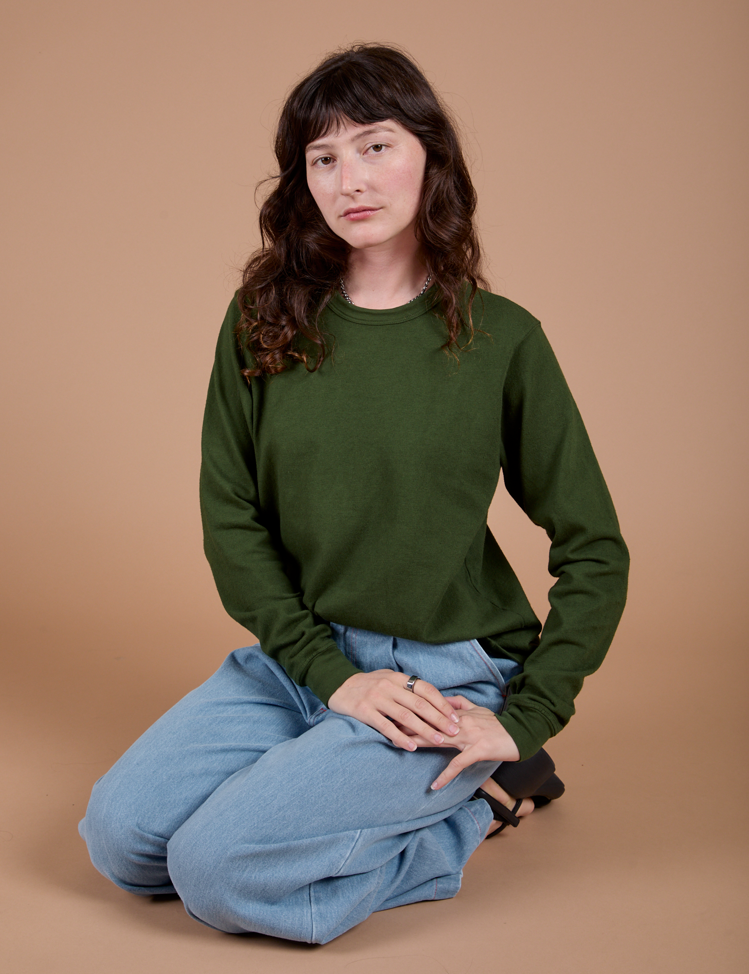 Alex is wearing Long Sleeve Burly Tee in Evergreen