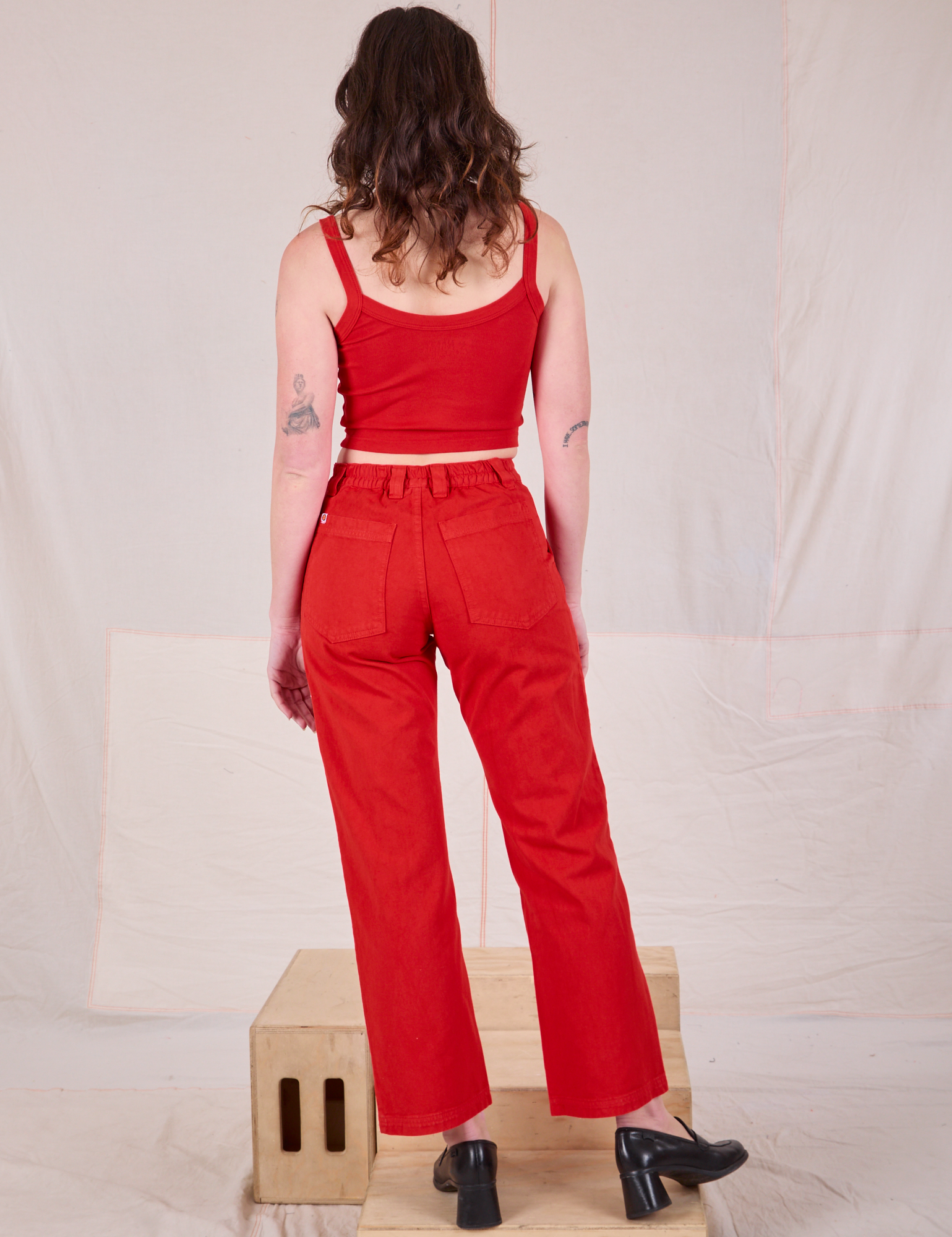 Back view of Mid-Rise Work Pants in Mustang Red and matching Cropped Cami on Alex