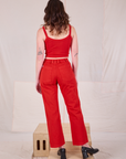 Back view of Mid-Rise Work Pants in Mustang Red and matching Cropped Cami on Alex