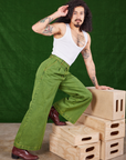 Jesse is wearing Overdyed Wide Leg Trousers in Gross Green and vintage off-white Cropped Tank Top