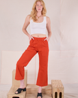 Margaret is 5'11" and wearing XXS Action Pants in Chili Red and Cropped Tank in Vintage Tee Off-White