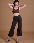 Alex is 5’8” and wearing XXS  Pants in Espresso Brown paired with fudgesicle brown Mini Tank