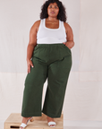 Morgan is 5'5" and wearing 2XL Action Pants in Swamp Green paired with Cropped Tank in vintage tee off-white