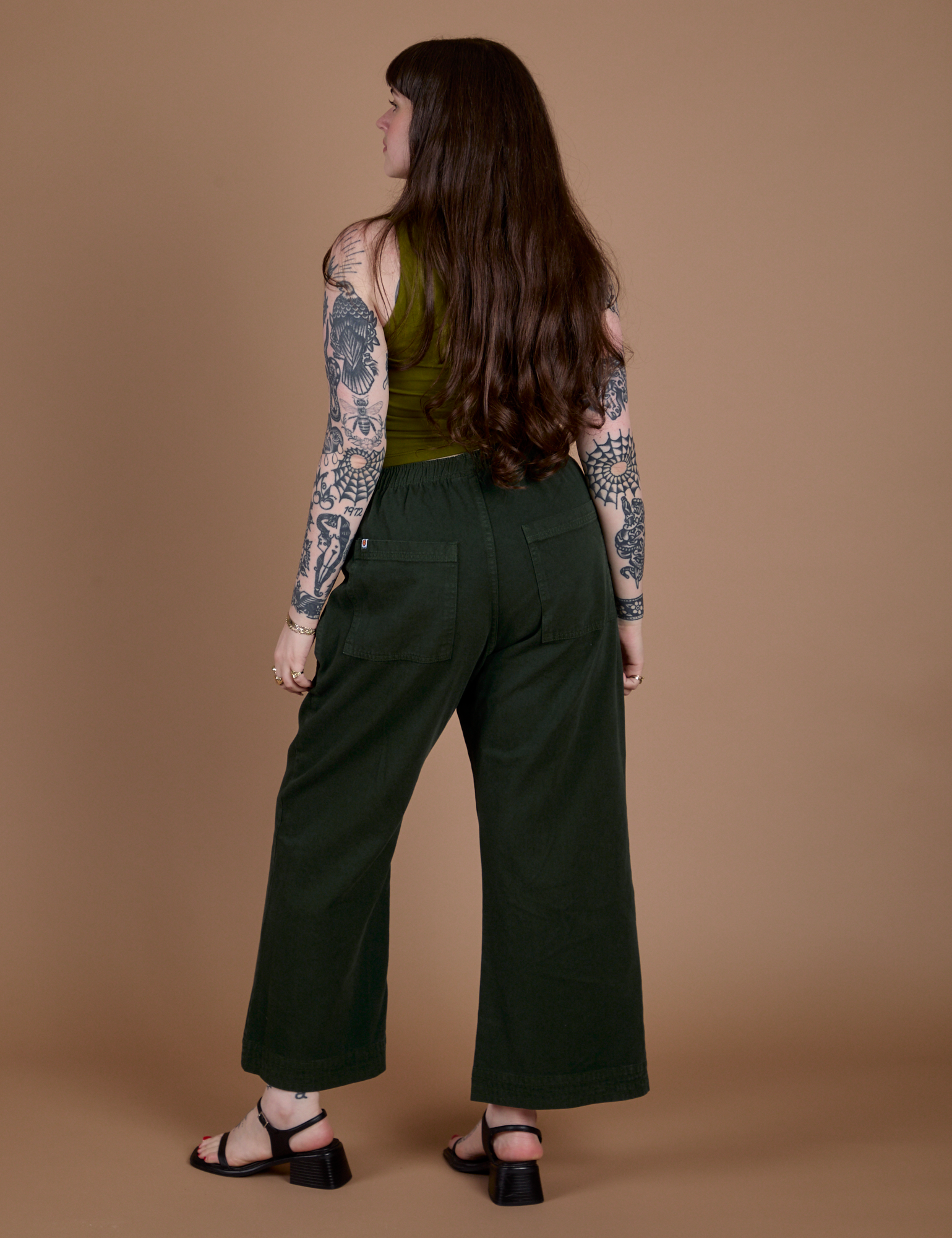 Action Pants in Swamp Green back view on Sydney