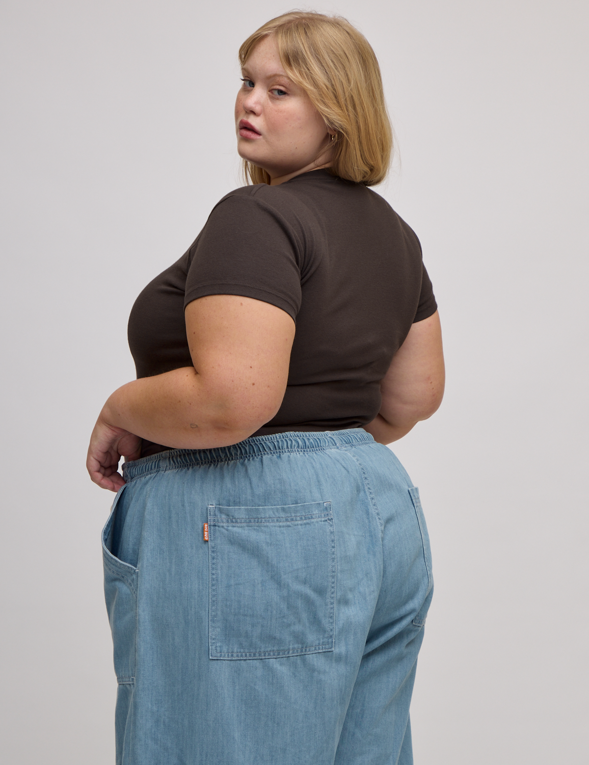 Angled back view of Baby Tee in Espresso Brown on Juliet