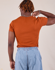 Baby Tee in Burnt Terracotta back view on Isaac