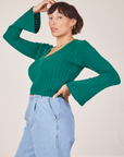 Side view of Bell Sleeve Top in Hunter Green worn by Tiara