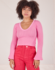 Gabi is wearing XXS Bell Sleeve Top in Bubblegum Pink paired with hot pink Work Pants