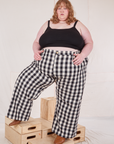 Catie is 5'11" and wearing 4XL Wide Leg Trousers in Big Gingham and black Cropped Cami