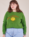 Sydney is 5'9" and wearing XS Bill Ogden's Sun Baby Crew in Lawn Green