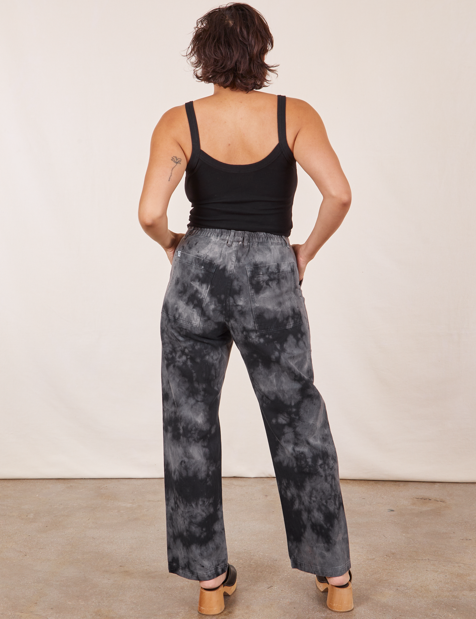 Back view of Black Magic Waters Work Pants and black Cropped Cami worn by Tiara