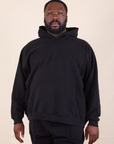 Elijah is 6'0" and wearing 2XL Oversized Hoodie in Basic Black