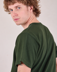 Burly Tee in Swamp Green shoulder close up on Quinn