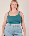 Lish is 5’8” and wearing M Cropped Cami in Marine Blue paired with light wash Carpenter Jeans