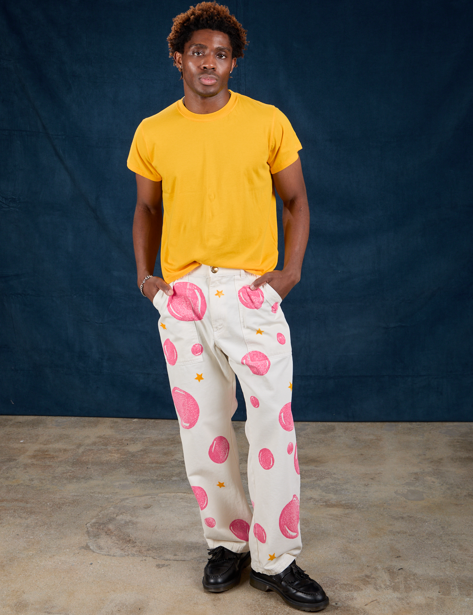 Isaac is 5&#39;10&quot; and wearing M Paintstamped Work Pants in Bubblegum