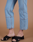 Carpenter Jeans in Light Wash pant leg side view on Alex