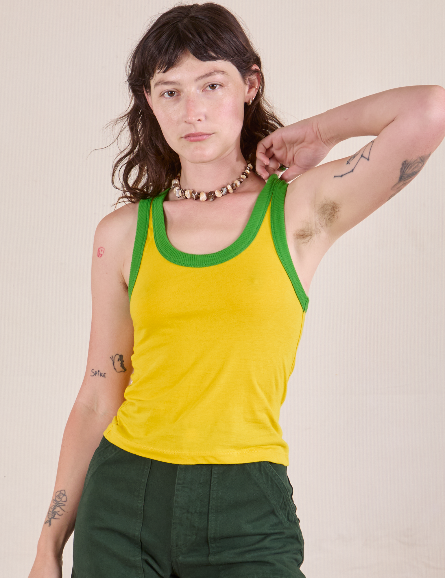 Alex is 5&#39;8&quot; and wearing P Colorblock Cropped Tank in Golden Yellow