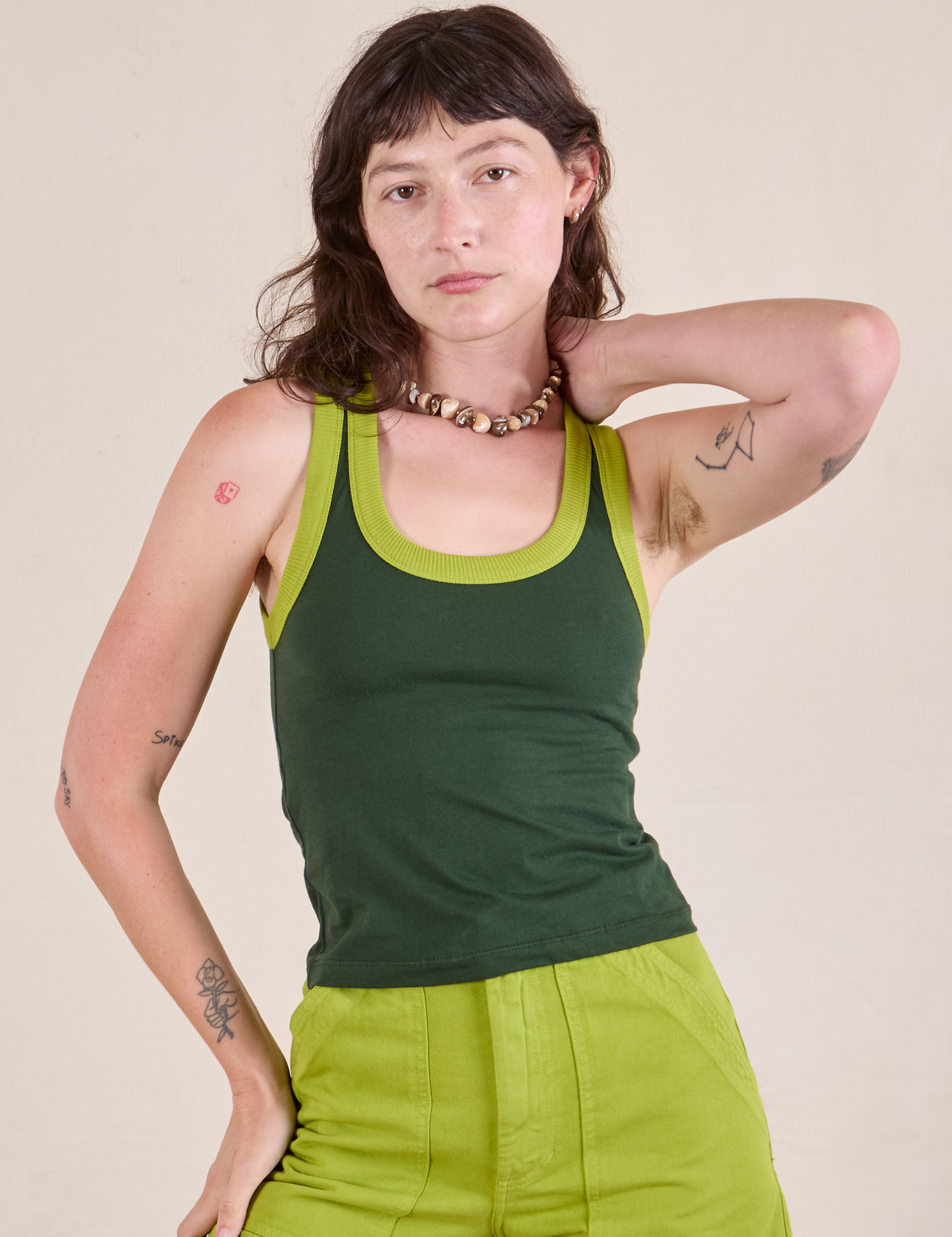 Alex is 5&#39;8&quot; and wearing P Colorblock Cropped Tank in Swamp Green