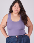 Ashley is 5'7" and wearing L Cropped Tank Top in Faded Grape