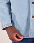 Denim Overshirt in Light Wash bottom close up on Issac